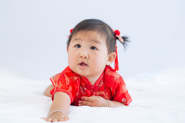 Girl in Chinese New Year costume,Happy Little asian girl in chinese traditional dress laughing and smiling.