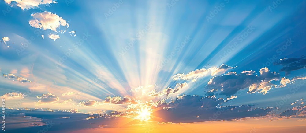 Poster sunset with sunrays fading behind clouds in the backdrop, perfect for copy space image.
