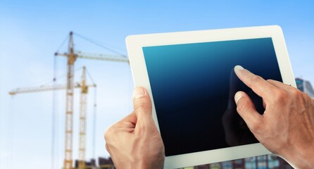 Smart Construction management . Hands with digital tablet