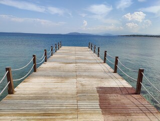 Gateway to the Horizon: The Pier Extending into the Vast Blue, Inviting a Journey of Discovery and Infinite Possibilities