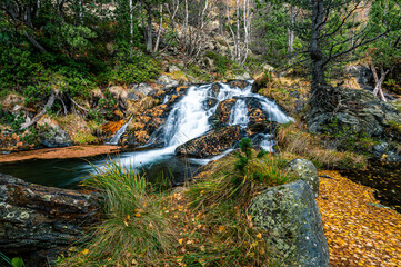 Fototapeta premium Mountain waterfall in autumn