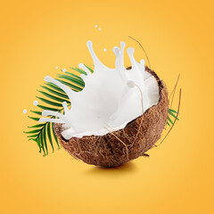coconut with palm leaf and milk splash on a light orange background