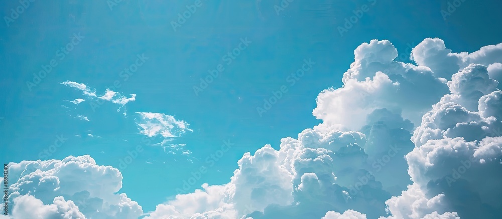 Poster white clouds against a blue sky background with ample copy space for customization in the image.