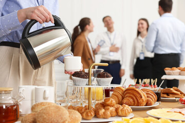 Coworkers having business lunch in restaurant, closeup