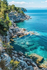 A rocky shoreline with a body of water in the background. The water is clear and calm, with some rocks visible in the foreground. Concept of tranquility and peacefulness, as the water