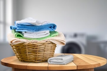 Set of fresh towels on desk in bathroom.