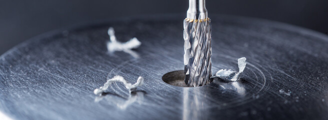 Milling cutter make sink in hole in steel billet. Locksmith work.