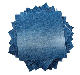 Piece of torn denim on a white background. Denim texture