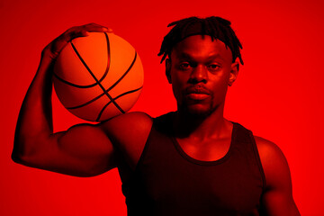 Basketball, bicep and portrait with man in red filter lighting for challenge, game or performance...