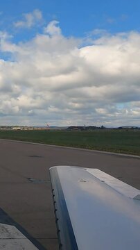 aircraft backtracking on the runway ready for departure and take off wing view window airport aviation