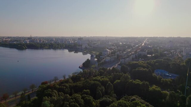 Aerial view of Ternopil, Ukraine, shows urban landscape with Seret River under clear sky on sunny day