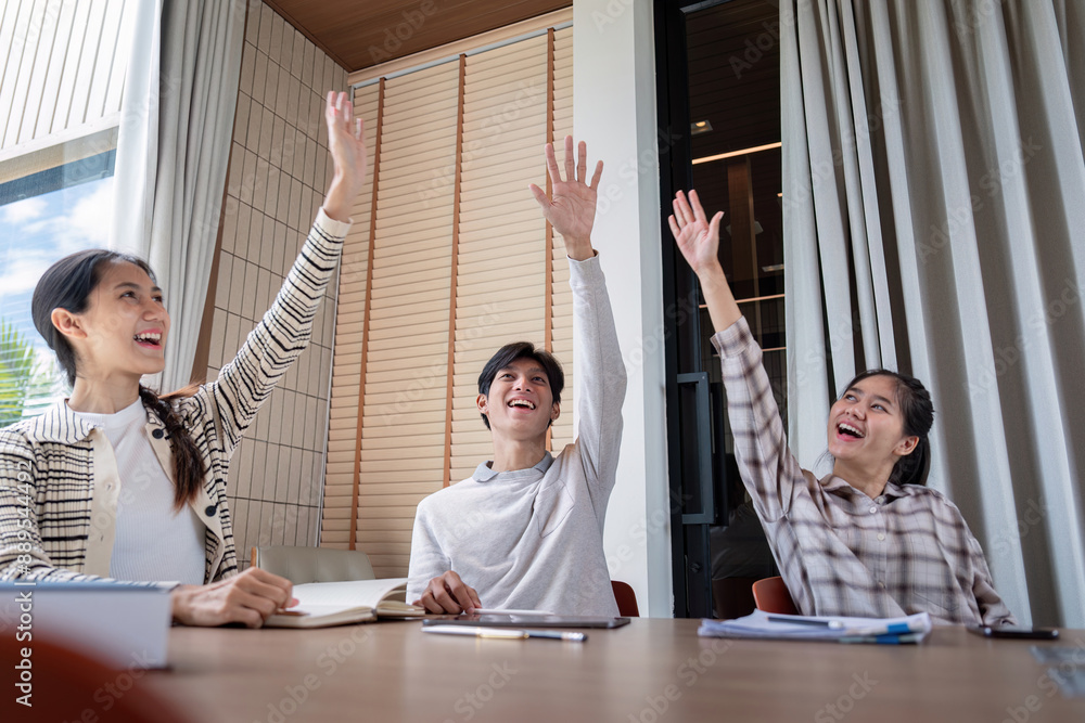 Poster enthusiastic student raising hands in classroom during interactive learning session
