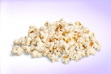 Flying tasty fresh salt popcorn on background