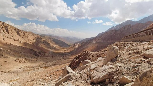The Salang Pass. Primary mountain pass connecting northern Afghanistan with Parwan Province. Beautiful static time lapse Afghnaistan mountains landscape panorama in sunny day