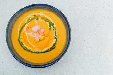 cream of corn soup with confit shrimp,  top view