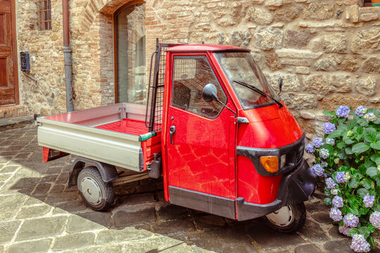 SAN GIMIGNANO, ITALY - JUNE 21, 2024:Piaggio Ape 50, an Italian three-wheeled light commercial vehicle based on the Vespa Scooter.