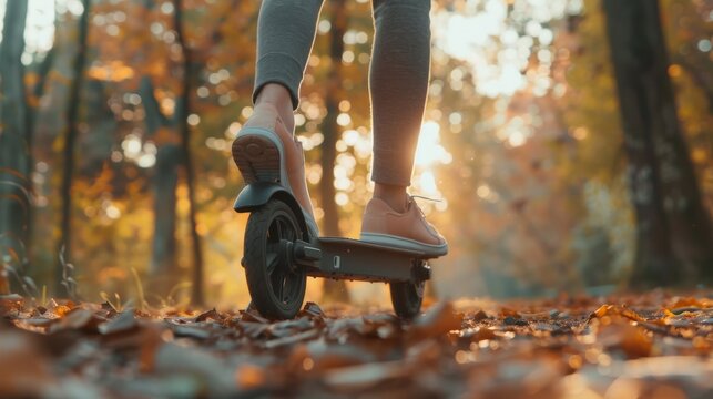 The scooter rider is on a dirt road. Good for travel or outdoor adventure themes.