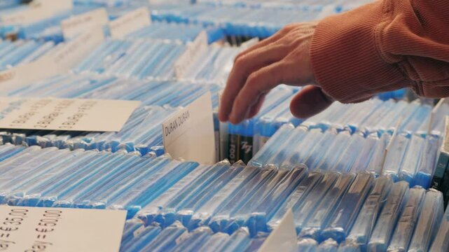 Organized DVD Collection Storage in Media Archive with systematic categorizations and order