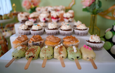 Candy bar at a wedding. Delicious desserts. Beautiful decorations. Fruits. Sweet cakes on your holiday. Birthday. Sweet life. interior photo.