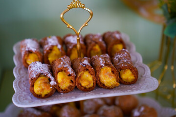 Candy bar at a wedding. Delicious desserts. Beautiful decorations. Fruits. Sweet cakes on your holiday. Birthday. Sweet life. interior photo.