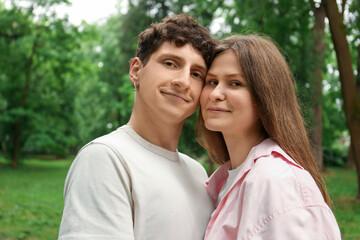 Fototapeta premium International dating. Lovely young couple spending time together in park