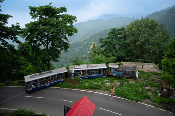 Darjeeling,West Bengal,India - 10th August 2023 : Diesel Toy train passing through curve of...
