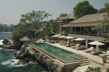 Obraz premium Luxurious Resort with Infinity Pool and Coastal View Offering a Serene and Scenic Tropical Vacation Experience