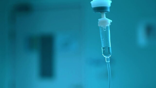 Dripping saline, Dripping medical perfusion close up equipment in clinic background, Medical equipment, Saline Solution IV Drip Fluid for Infusion in Hospital. Intravenous drip in operation room.