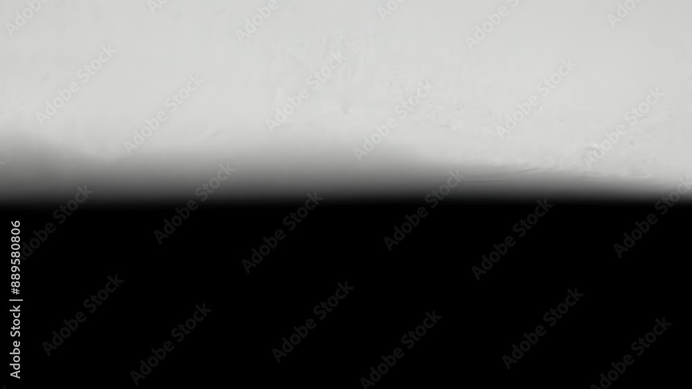 Poster the shadows edge is sharp and defined creating a stark contrast with the surrounding area.