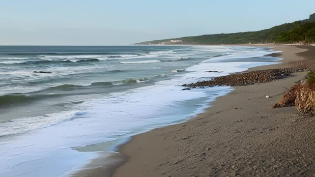 Timelapse of tides washing away sand and sediment from a beach leaving behind a steeper and more vulnerable coastline.