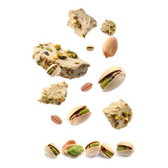 Sweet pistachio halva and nuts in air on white background