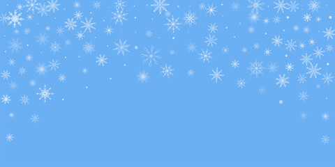 Snowflakes. Snow, snowfall. Falling scattered white snowflakes on a blue background.