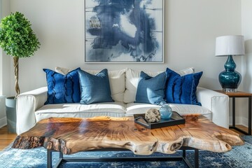 Live edge accent coffee table near white sofa with blue pillows against wall with big poster frame. Coastal home interior design of modern living, Generative AI