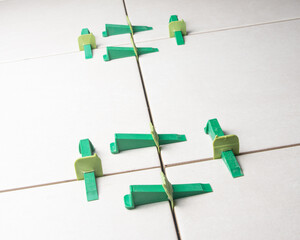 Tile leveling system with plastic clips and wedges