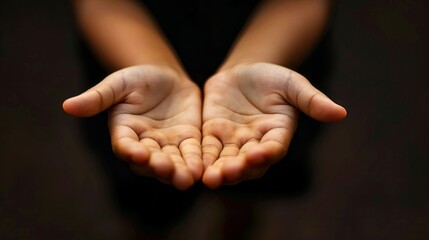 A hand is shown with the fingers spread out, as if it is offering something