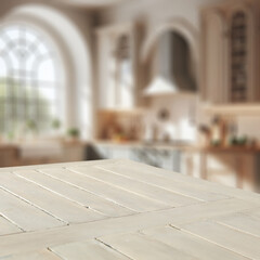 Blurred kitchen background and empty wooden table with copy space for products amd montage objects display.