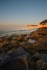 seascape rocky beach at sunset