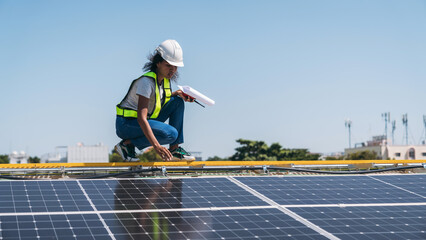 The engineer installs the solar panel, promoting the clean energy concept.