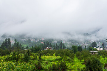 Old Manali town shrouded in misty clouds in Monsoon season. It is a popular Heaven for back packers and nature lovers for its natural beauty of Himalayas in Kullu region.