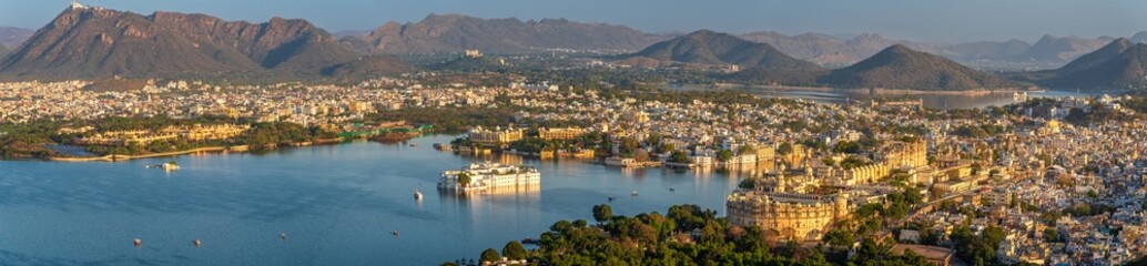 Fototapeta premium Panoramic aerial view of Udaipur city also known as city of lakes from Karni Mata Temple, Rajasthan. Udaipur city is a popular honeymoon destination among tourist in India.