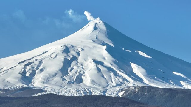 Villarrica Volcano At Pucon Los Rios Chile. Snow-Capped Volcano Releasing Plumes Of Smoke Into Blue Sky. Snowy Lake Swiss Alps Exploring. Forest Trees Swiss Alps Nature. Pucon Los Rios.