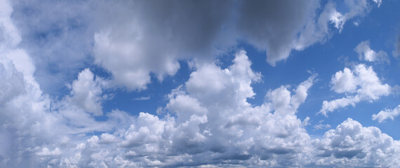 White cumulus clouds in blue sky beautiful cloud background.