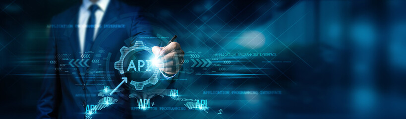 Businessman drawing an API diagram of functions and data, analyzing integration and efficiency data, optimizing, scaling, automating, and strategizing on a blue background.
