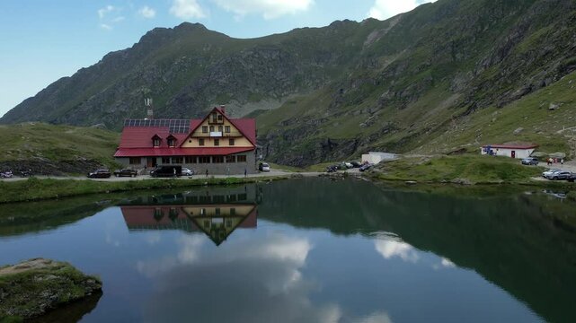 Aerial top view lake in the mountains. Balea Lake, glacier lake situated at of altitude in the Fagaras Mountains, in Romania, Sibiu County.