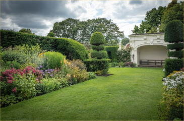 White painted seating area in an english country garden