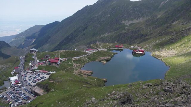Aerial top view lake in the mountains. Balea Lake, glacier lake situated at of altitude in the Fagaras Mountains, in Romania, Sibiu County.