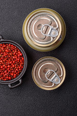Metal can with canned meat or fish with a key to open it