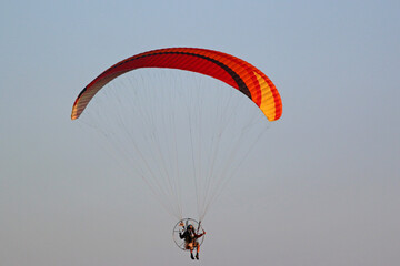 Paramotor pilot coming in to land