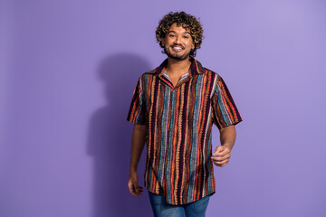 Photo of pleasant good mood latin man with wavy hairdo dressed print shirt go shopping on sale isolated on purple color background