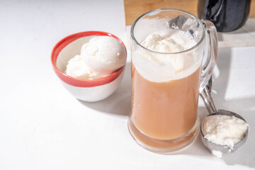 Ice cream beer floating cocktail, summer cold refreshment alcoholic drink, Root beer float in pint mug glass, copy space